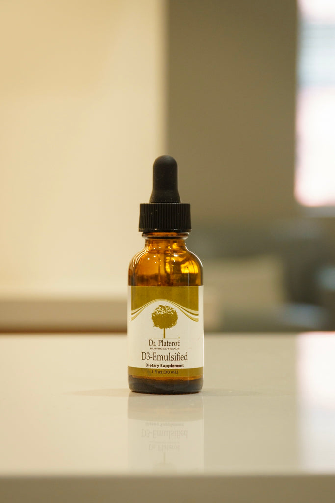 Bottle of D3-Emulsified dietary supplement on a surface with a blurred background