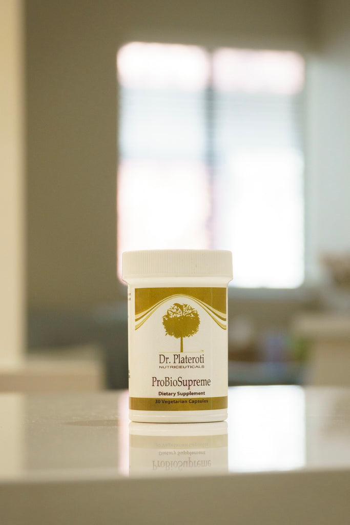 Dr. Plateroti Probiotic Supreme container on a blurred background